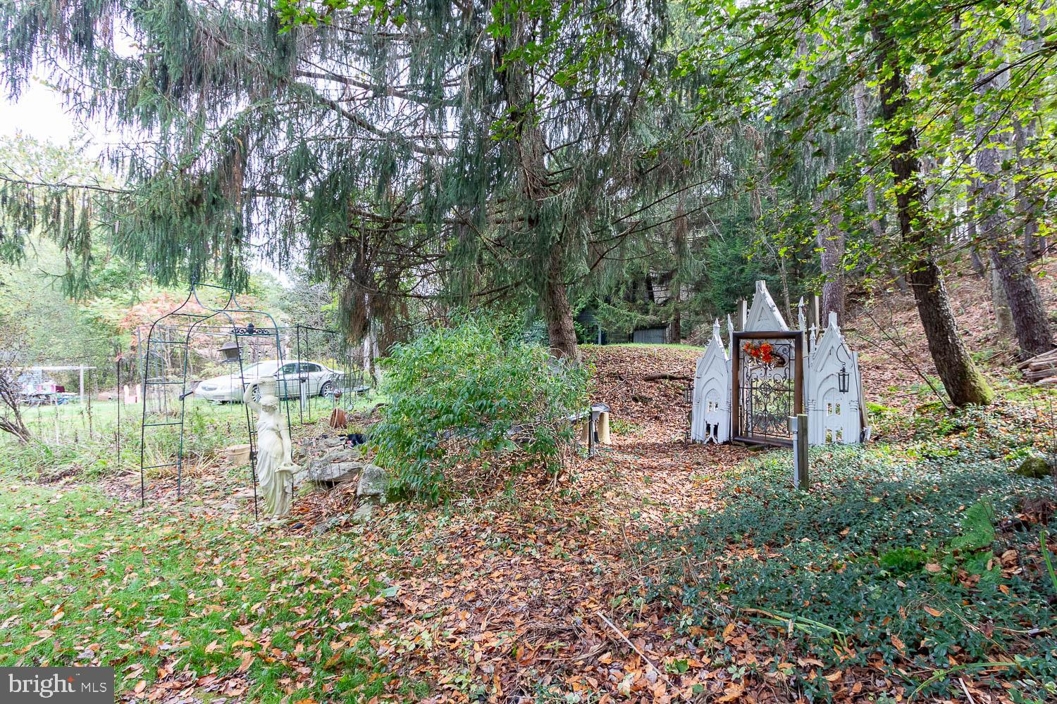 125 Colorado Road Munson, PA 16860 - Photo 43 of 43 a row of table and chairs in the garden