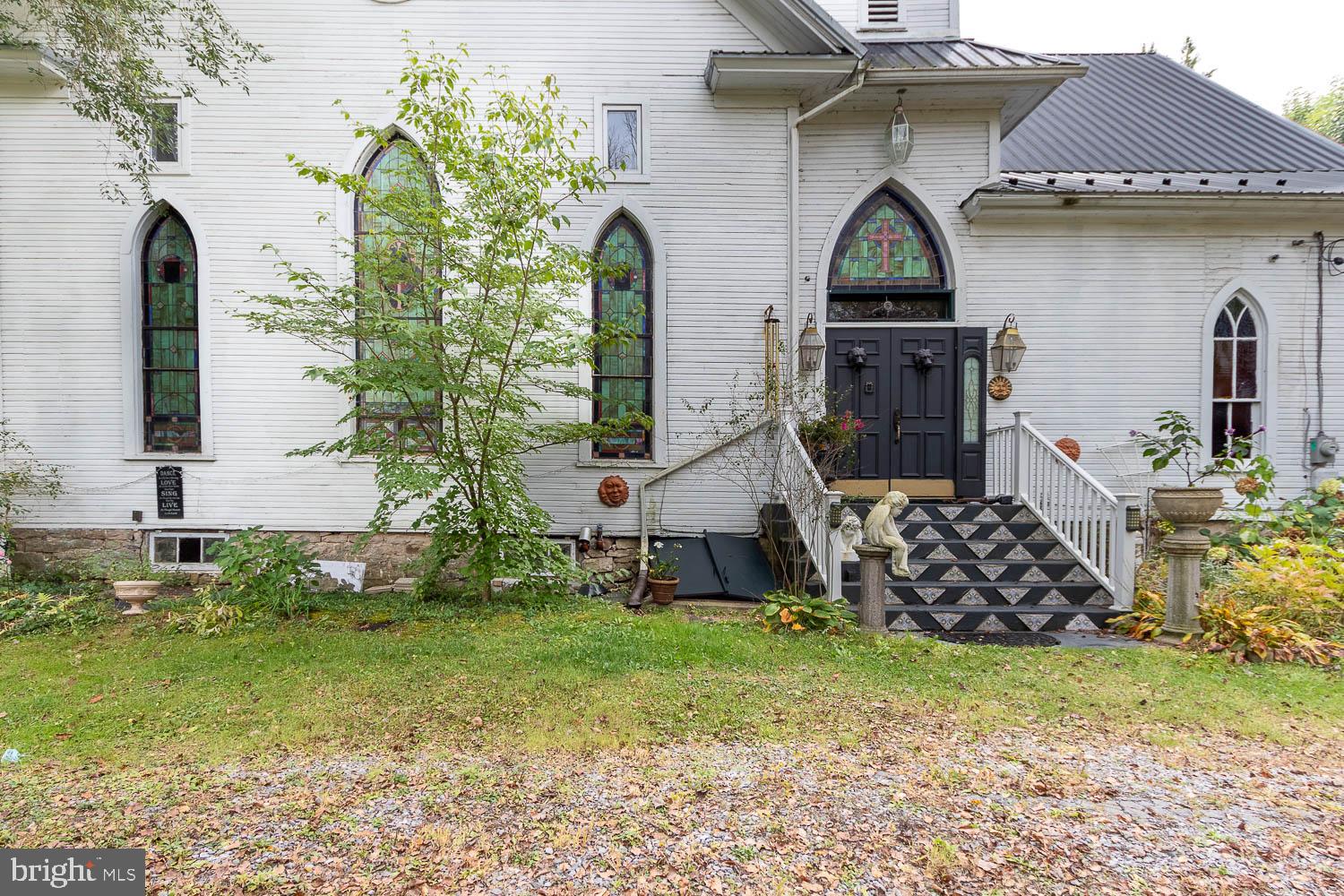 125 Colorado Road Munson, PA 16860 - Photo 5 of 43 a front view of a house with garden