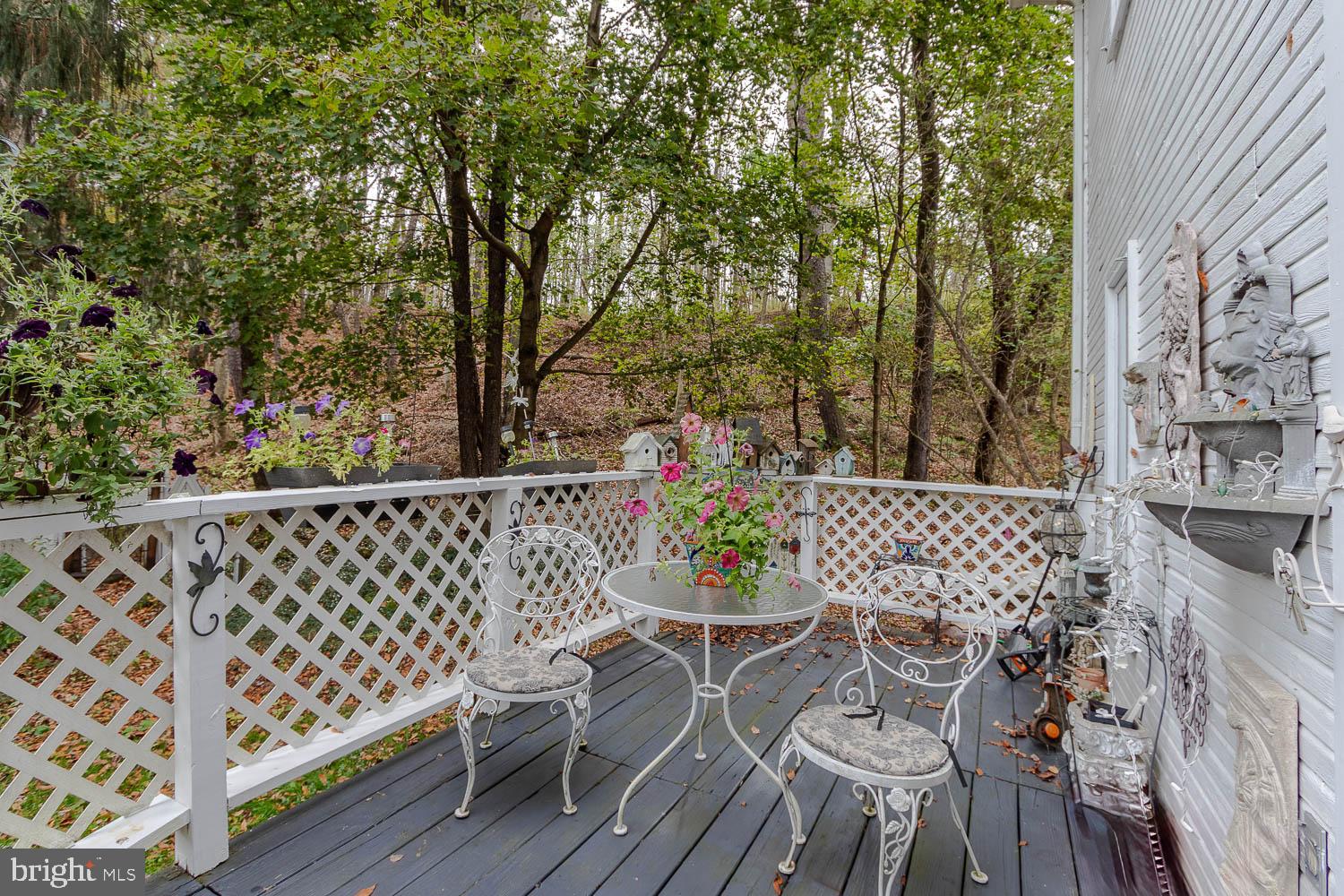 125 Colorado Road Munson, PA 16860 - Photo 9 of 43 a view of a chairs and table on the wooden floor