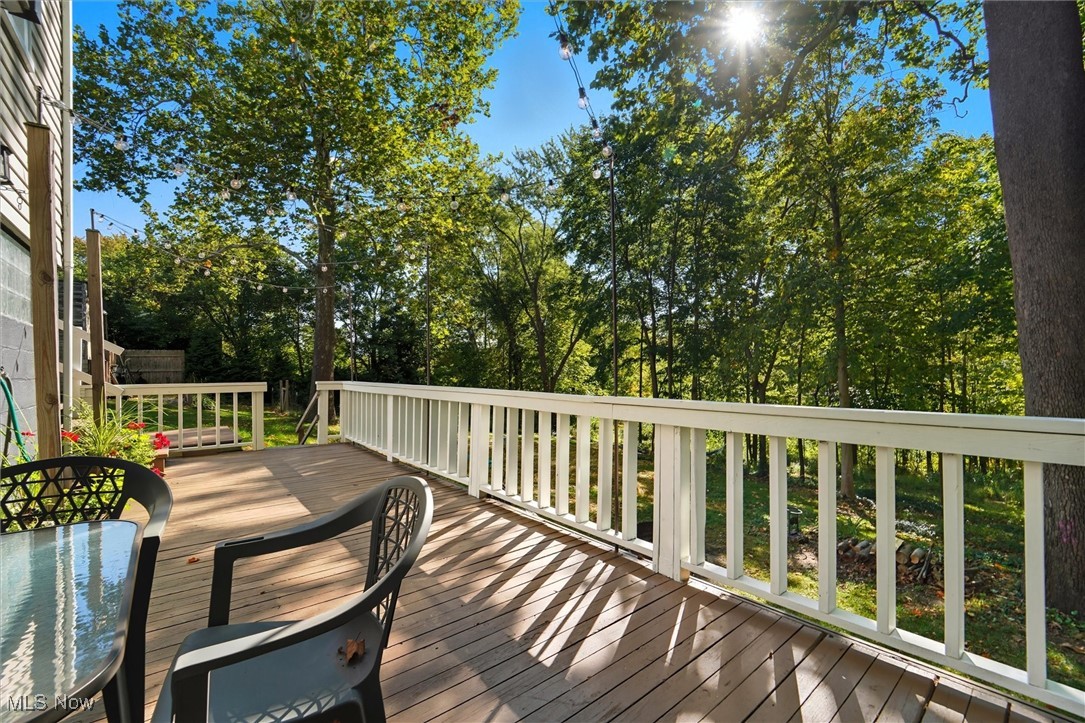 10536 Johnnycake Ridge Road Painesville, OH 44077 - Photo 30 of 40 Wooden deck featuring view of wooded area