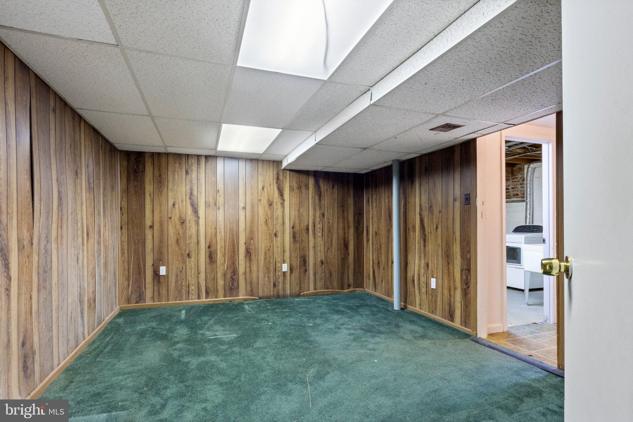 2514 Ritchie Road District Heights, MD 20747 - Photo 19 of 24 Cozy basement with wood paneling charm.