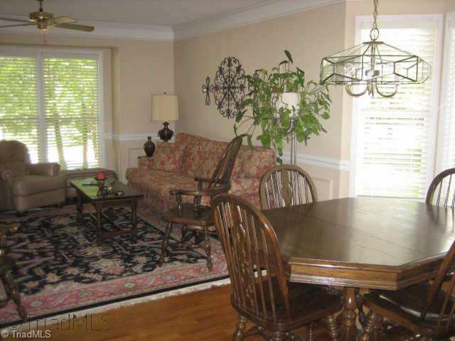 5102 Candlewick Road Greensboro, NC 27455 - Photo 3 of 8 Other. Living room/dining room with bay window; Oak hardwood floors recently installed and throughout most of home