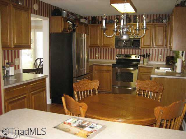 5102 Candlewick Road Greensboro, NC 27455 - Photo 4 of 8 Other. Kitchen/breakfast area. All new SS appliances stay!