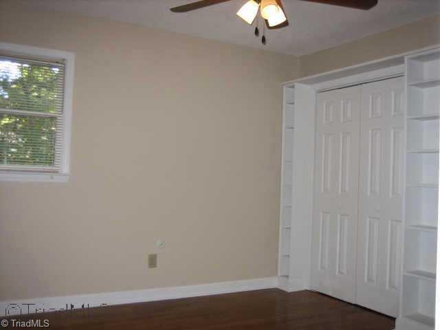 5102 Candlewick Road Greensboro, NC 27455 - Photo 7 of 8 Other. Another bedroom with hardwood floors and double closets with built-ins
