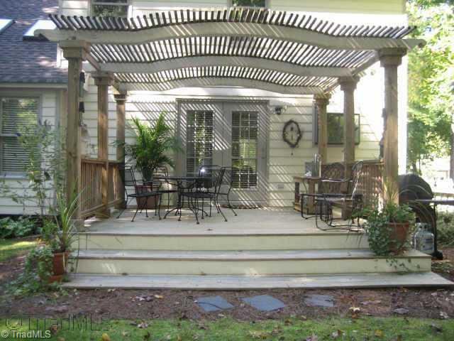 5102 Candlewick Road Greensboro, NC 27455 - Photo 8 of 8 Other. Beautiful custom deck with arbor on a natural landscaped yard, complete with storage shed