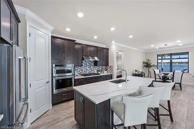 a kitchen with a table and chairs in it