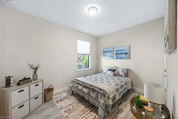 a bedroom with a bed and a dresser