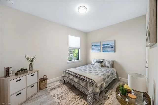 a bedroom with a bed and a dresser