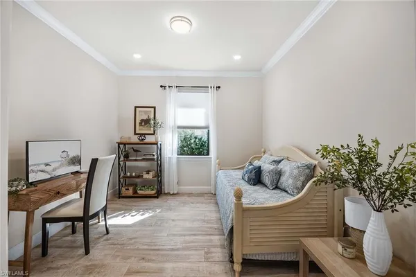 a bedroom with furniture and a bed