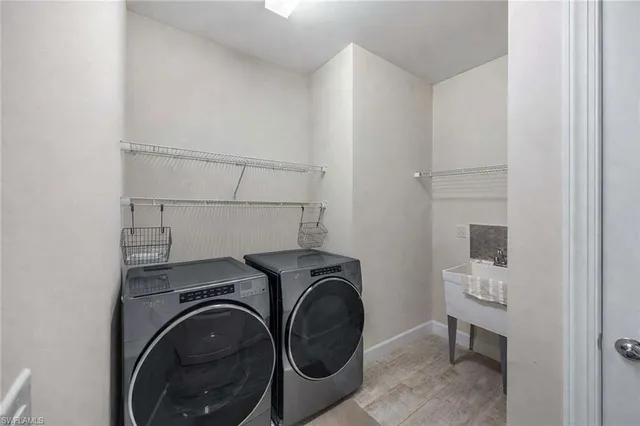 a utility room with dryer and washer