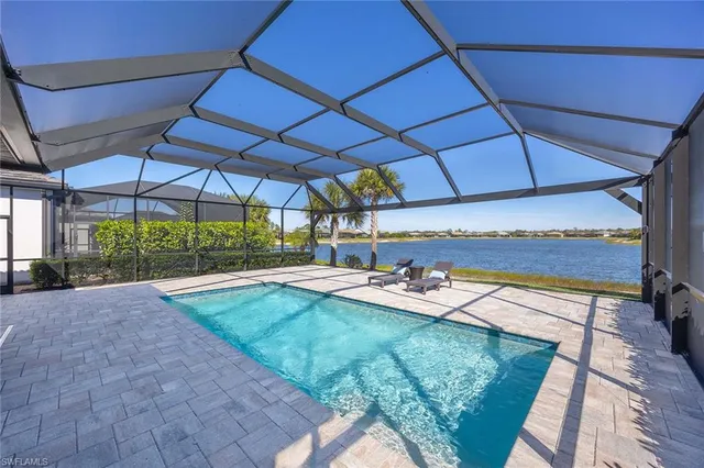 a view of a backyard with sitting area