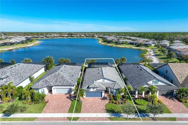 an aerial view of a house with a ocean view