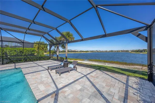 a view of a backyard with sitting area