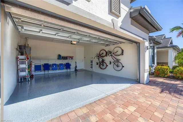 a view of a hallway with wooden floor and stairs