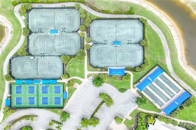 a room with painting on the wall and a table