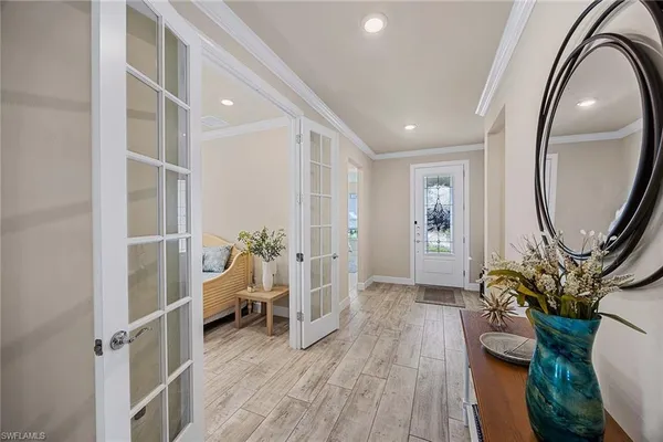 a view of a livingroom with furniture and hardwood floor