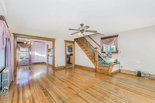 a view of an entryway with wooden floor