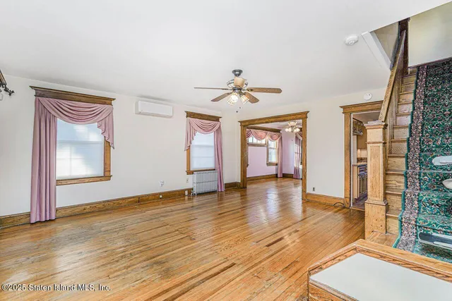 a view of an entryway with wooden floor