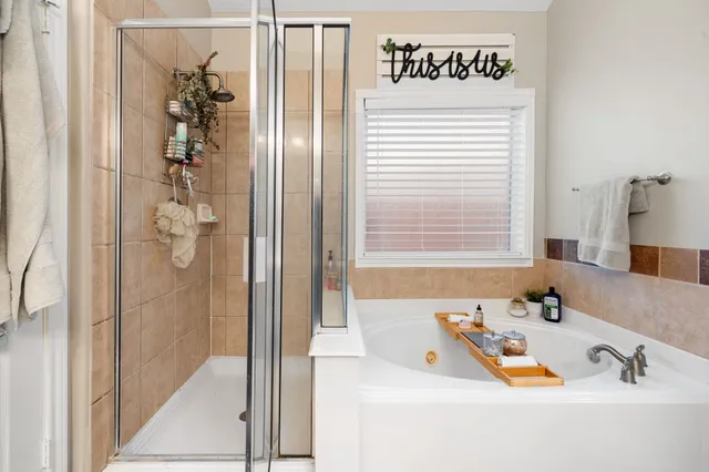a bathroom with a tub and a sink