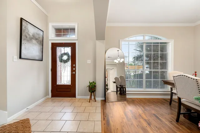 a view of livingroom with furniture wooden floor and windows