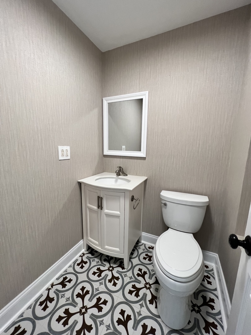 2535 Techny Road Northbrook, IL 60062 - Photo 12 of 30 a bathroom with a toilet sink and mirror