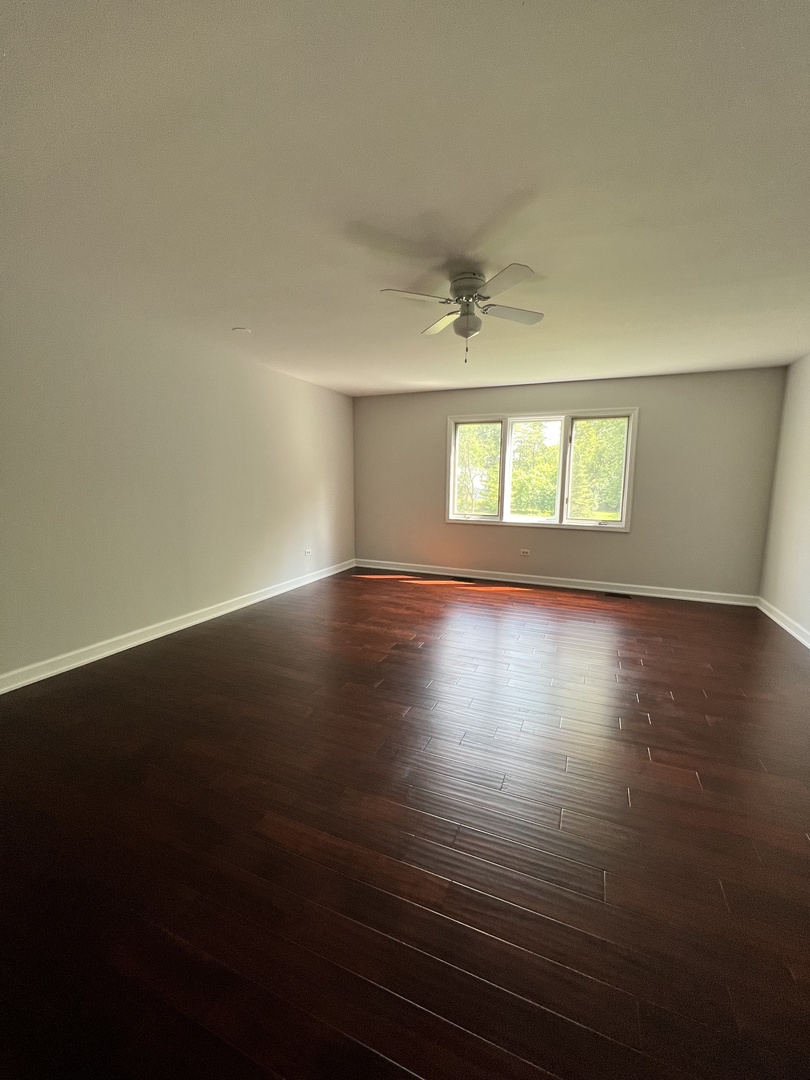 2535 Techny Road Northbrook, IL 60062 - Photo 13 of 30 an empty room with wooden floor and windows