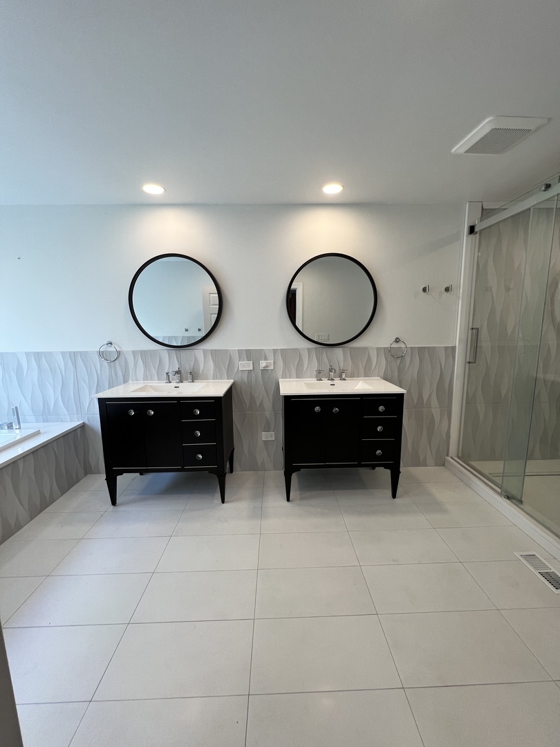 2535 Techny Road Northbrook, IL 60062 - Photo 14 of 30 a living room with furniture a mirror and a sink