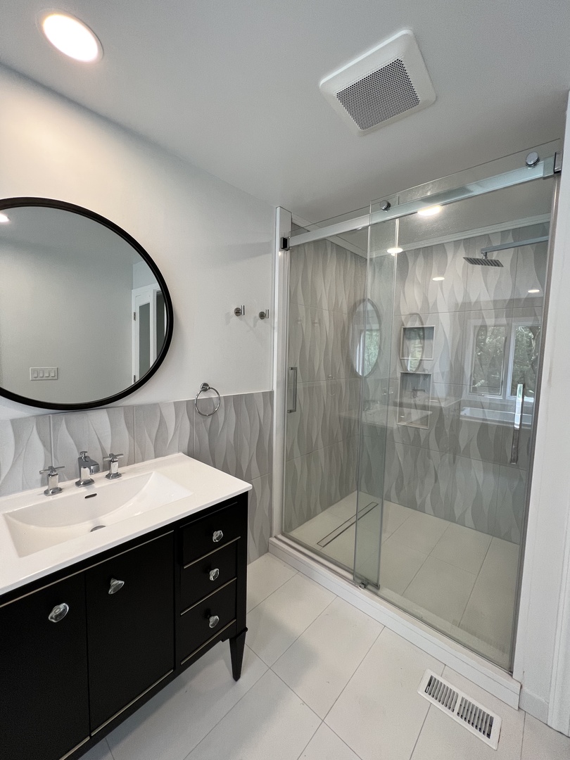 2535 Techny Road Northbrook, IL 60062 - Photo 15 of 30 a bathroom with a double vanity sink mirror and shower