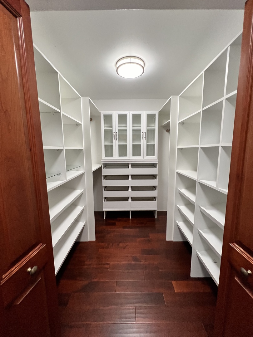 2535 Techny Road Northbrook, IL 60062 - Photo 18 of 30 a view of walk in closet with empty racks