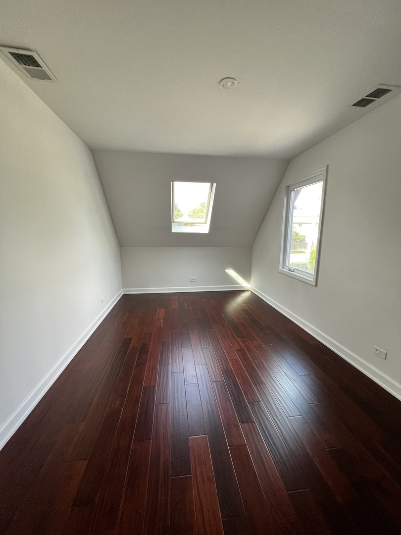 2535 Techny Road Northbrook, IL 60062 - Photo 20 of 30 an empty room with wooden floor and windows