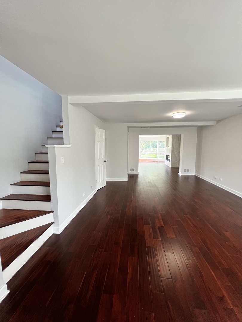2535 Techny Road Northbrook, IL 60062 - Photo 7 of 30 wooden floor in an empty room with a window