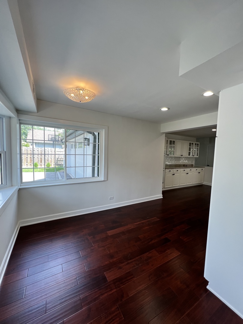 2535 Techny Road Northbrook, IL 60062 - Photo 10 of 30 an empty room with wooden floor and windows