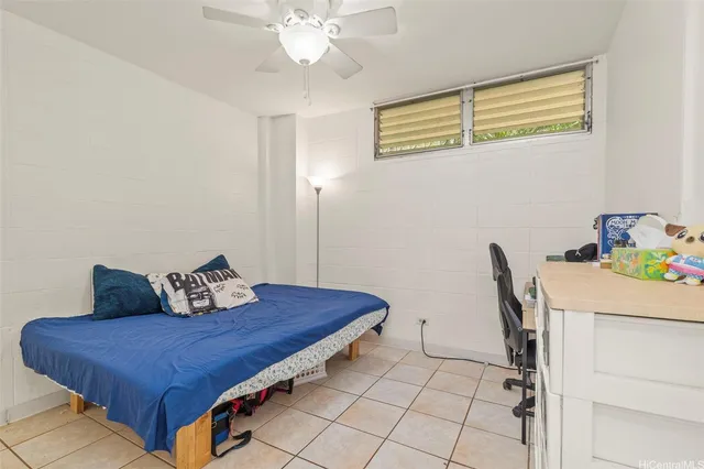 a bedroom with a bed and a table in it