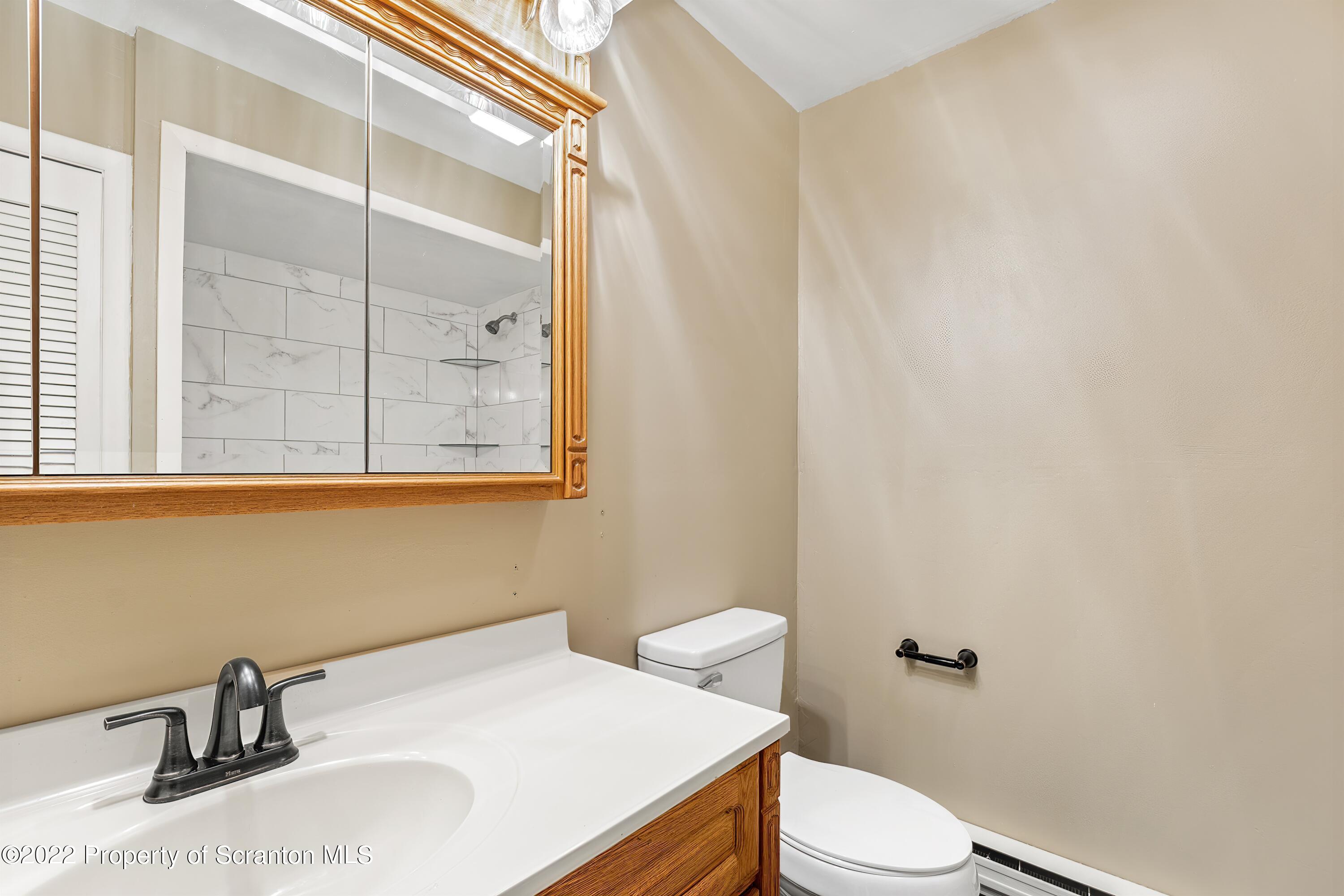 219 Noble Road Clarks Summit, PA 18411 - Photo 11 of 33 a bathroom with a sink and a toilet