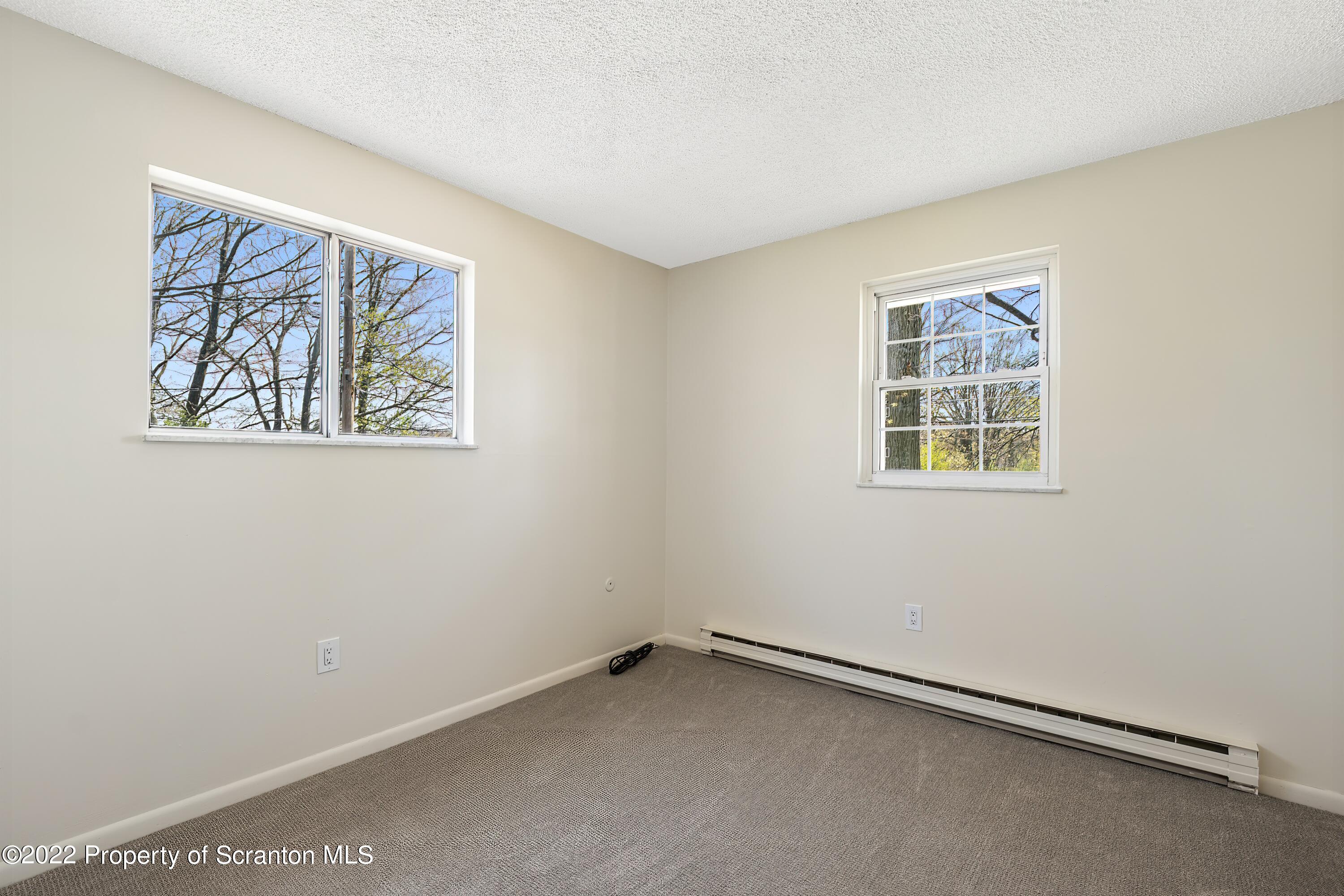 219 Noble Road Clarks Summit, PA 18411 - Photo 13 of 33 a view of an empty room with a window