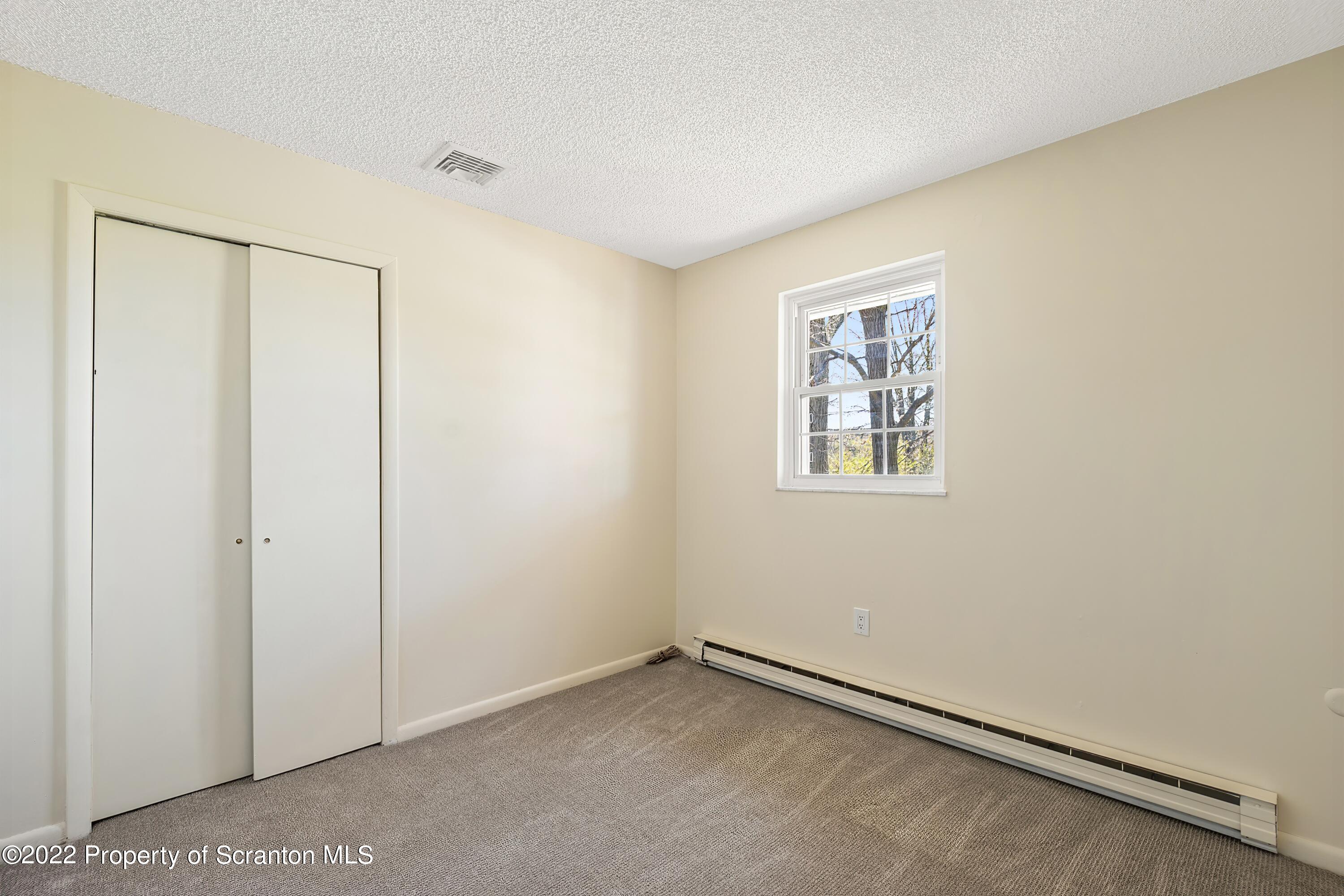 219 Noble Road Clarks Summit, PA 18411 - Photo 19 of 33 a view of an empty room with a window
