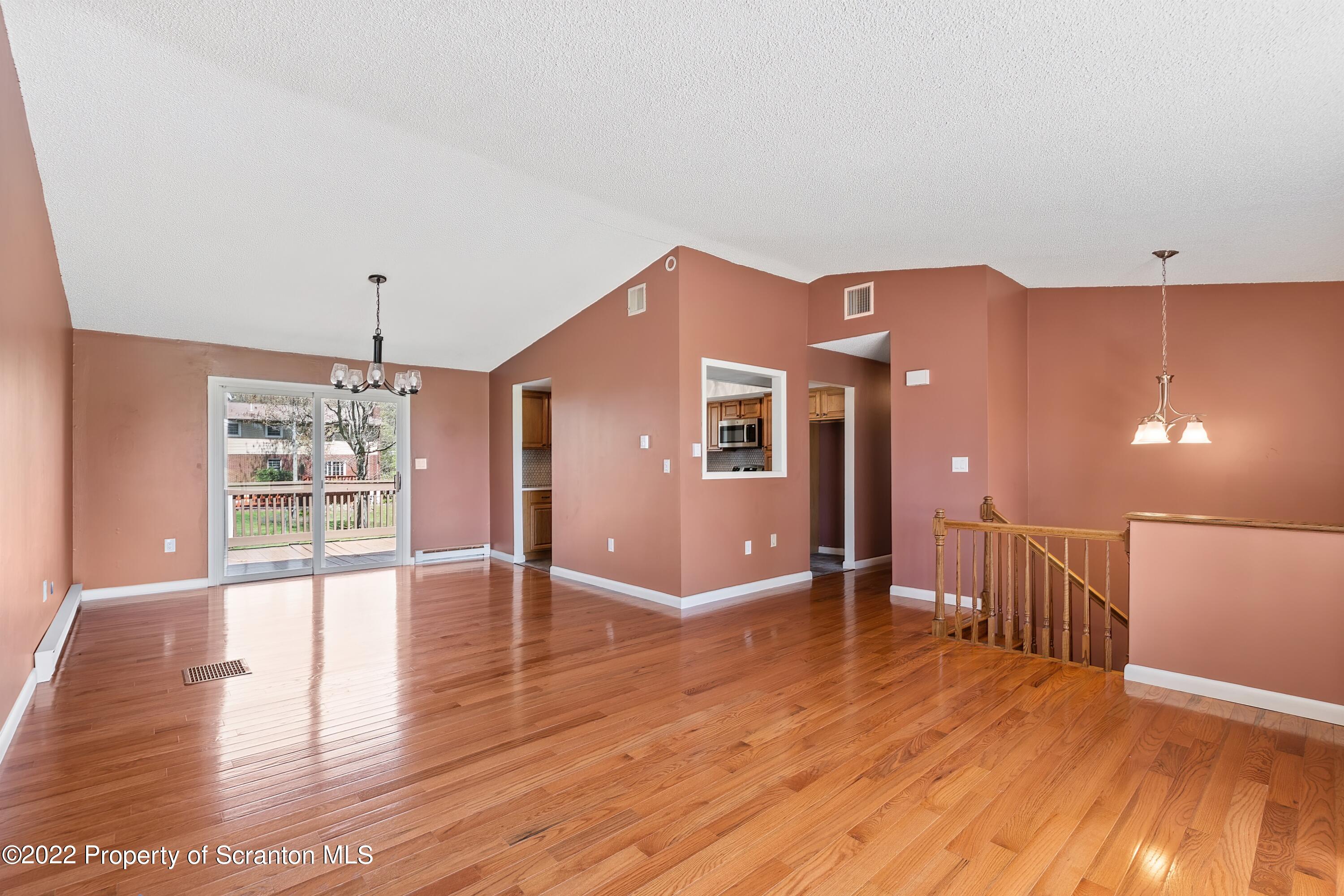 219 Noble Road Clarks Summit, PA 18411 - Photo 2 of 33 a view of an empty room with window and wooden floor