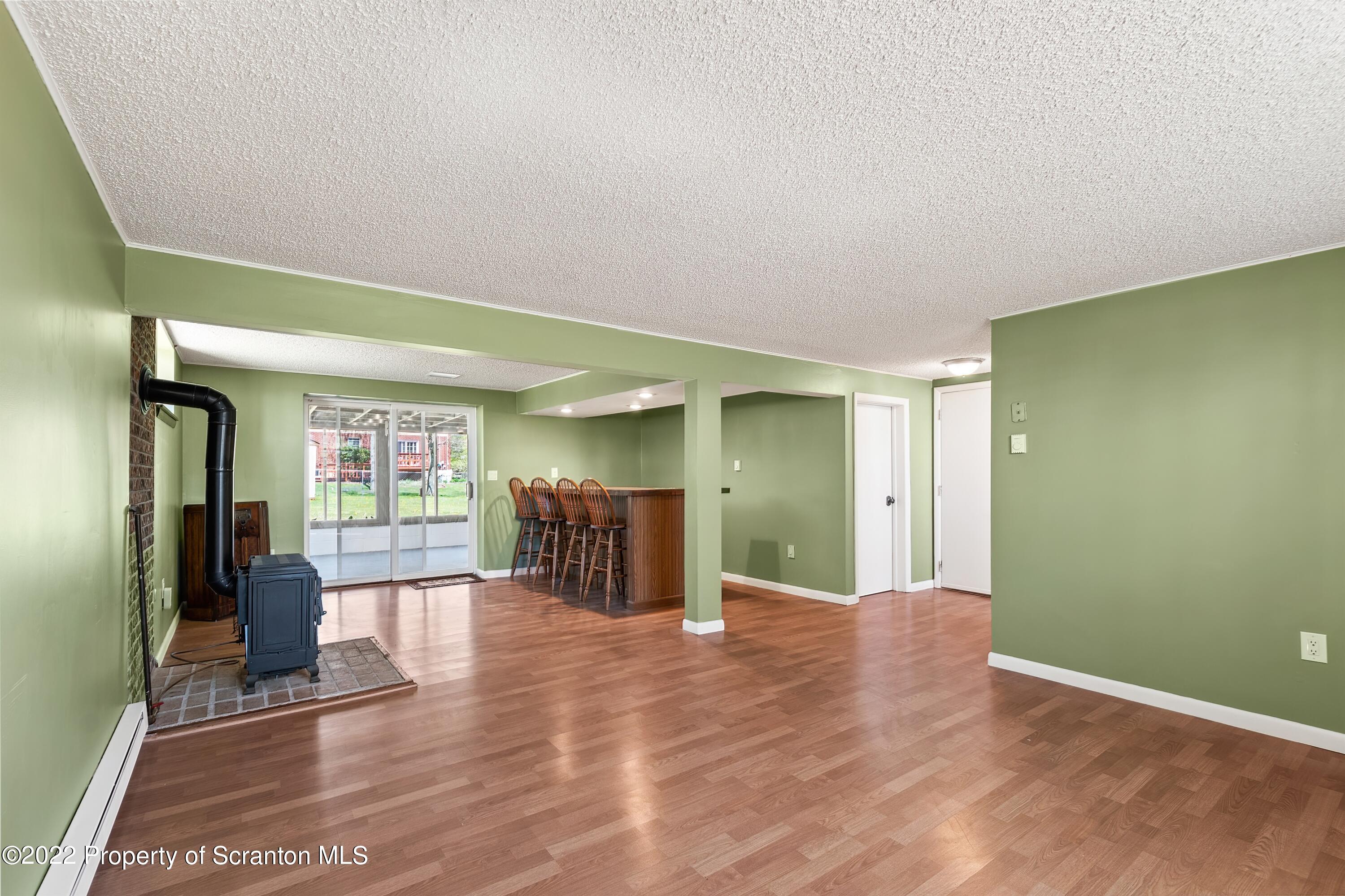 219 Noble Road Clarks Summit, PA 18411 - Photo 22 of 33 a view of a livingroom with furniture and windows