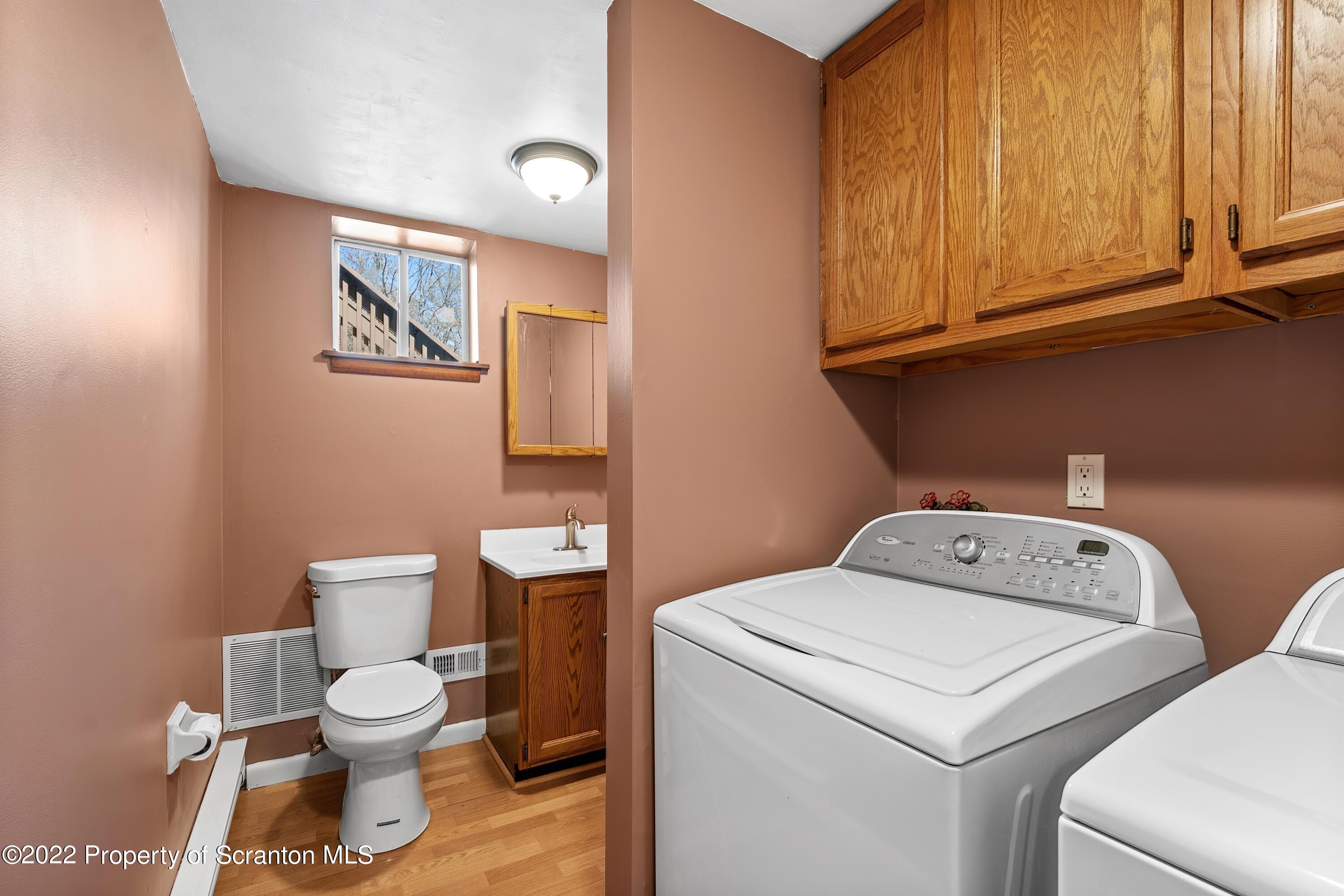 219 Noble Road Clarks Summit, PA 18411 - Photo 28 of 33 a white toilet sitting next to a bathroom sink