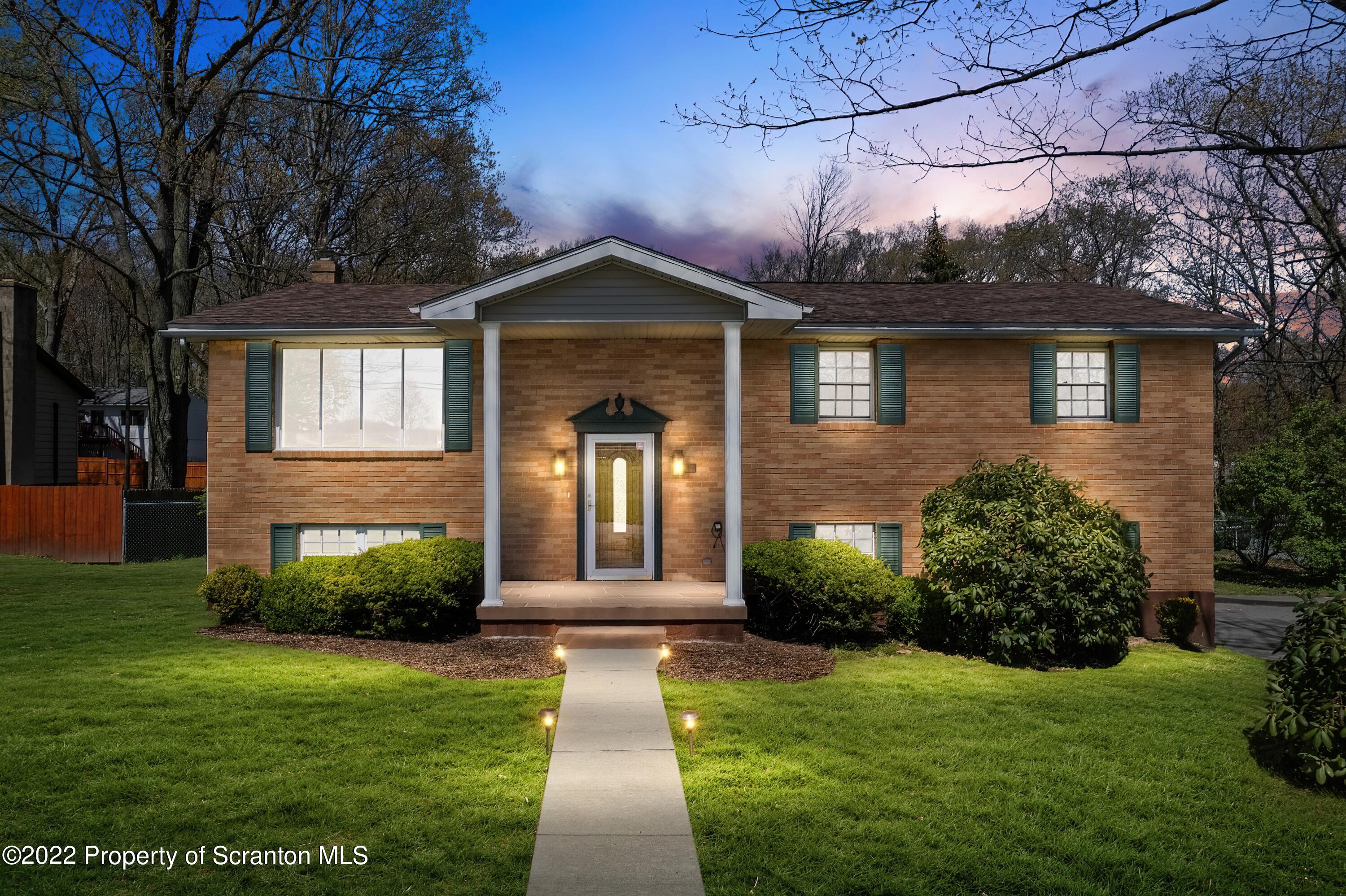 219 Noble Road Clarks Summit, PA 18411 - Photo 30 of 33 a front view of a house with garden