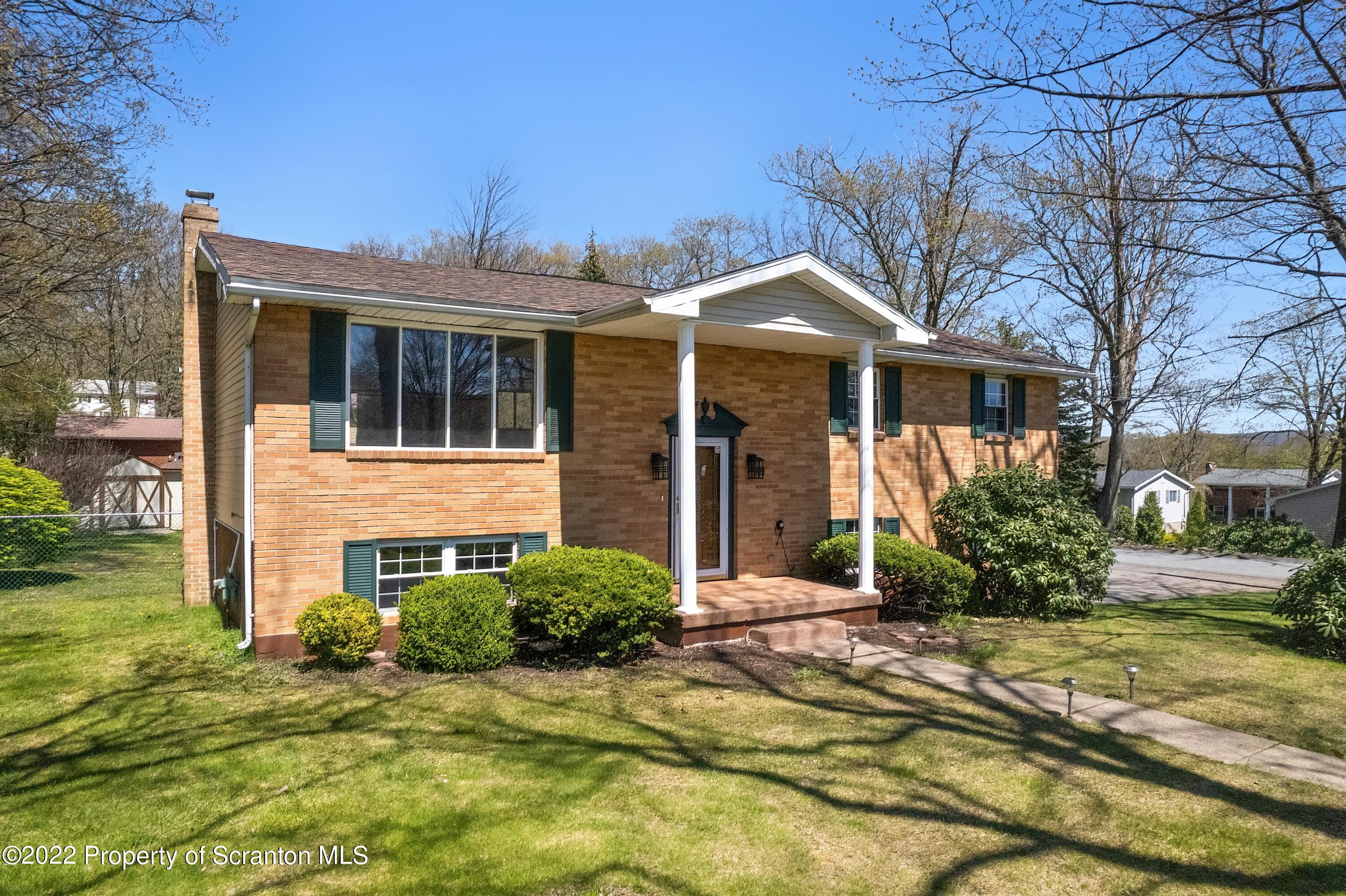 219 Noble Road Clarks Summit, PA 18411 - Photo 31 of 33 a front view of a house with a yard