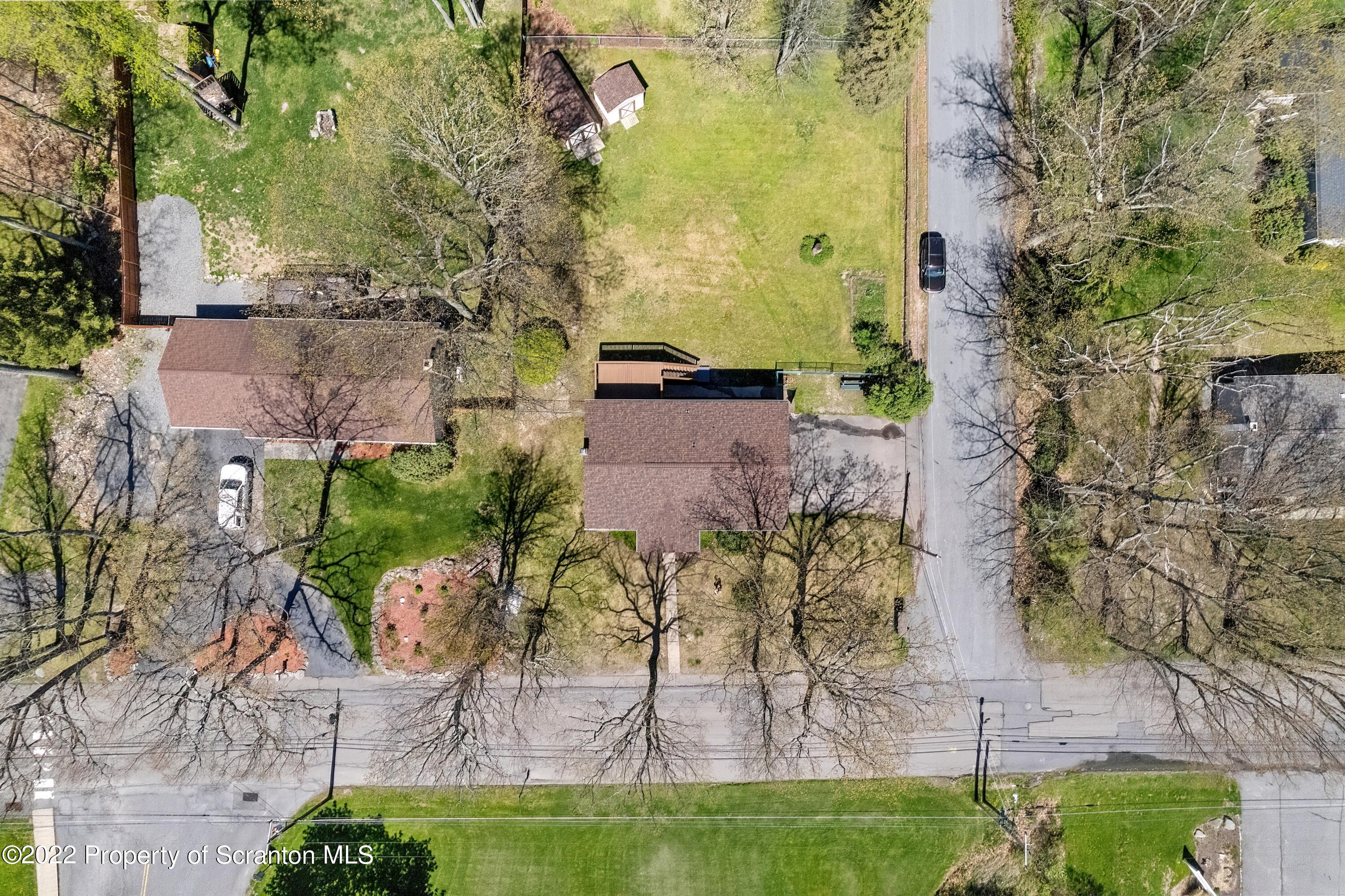 219 Noble Road Clarks Summit, PA 18411 - Photo 32 of 33 an aerial view of a house with a yard
