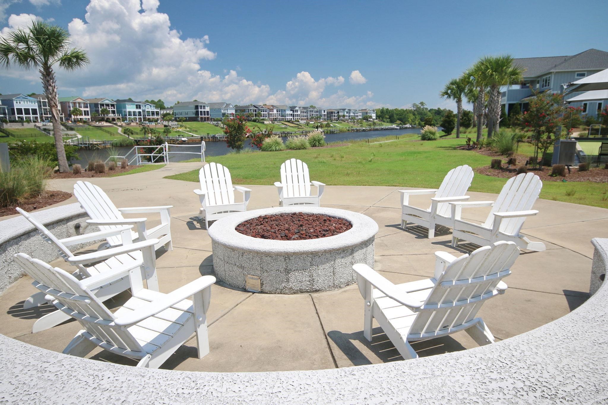 5830 Cremona Drive Myrtle Beach, SC 29577 - Photo 33 of 39 View of patio / terrace with a residential view, a water view, and a fire pit