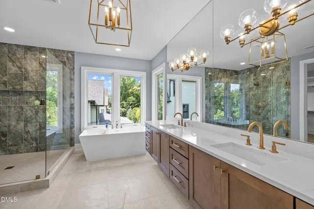 a large bathroom with a large tub and sink