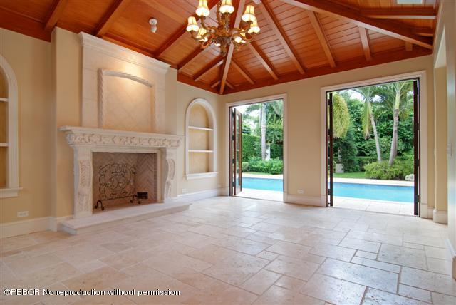 300 Arabian Road Palm Beach, FL 33480 - Photo 2 of 8 a view of an empty room with a fireplace and a window