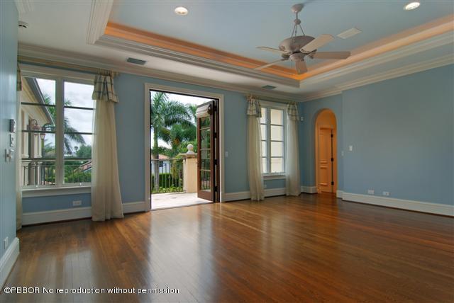 300 Arabian Road Palm Beach, FL 33480 - Photo 6 of 8 a view of an empty room with wooden floor and a window