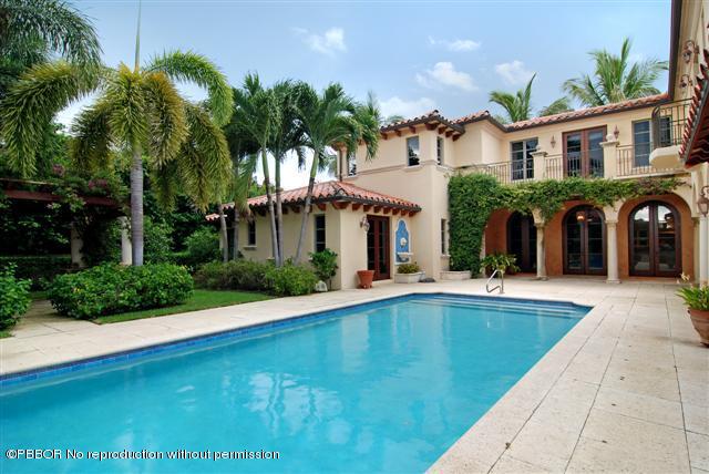 300 Arabian Road Palm Beach, FL 33480 - Photo 8 of 8 a view of a house with swimming pool and a porch with furniture