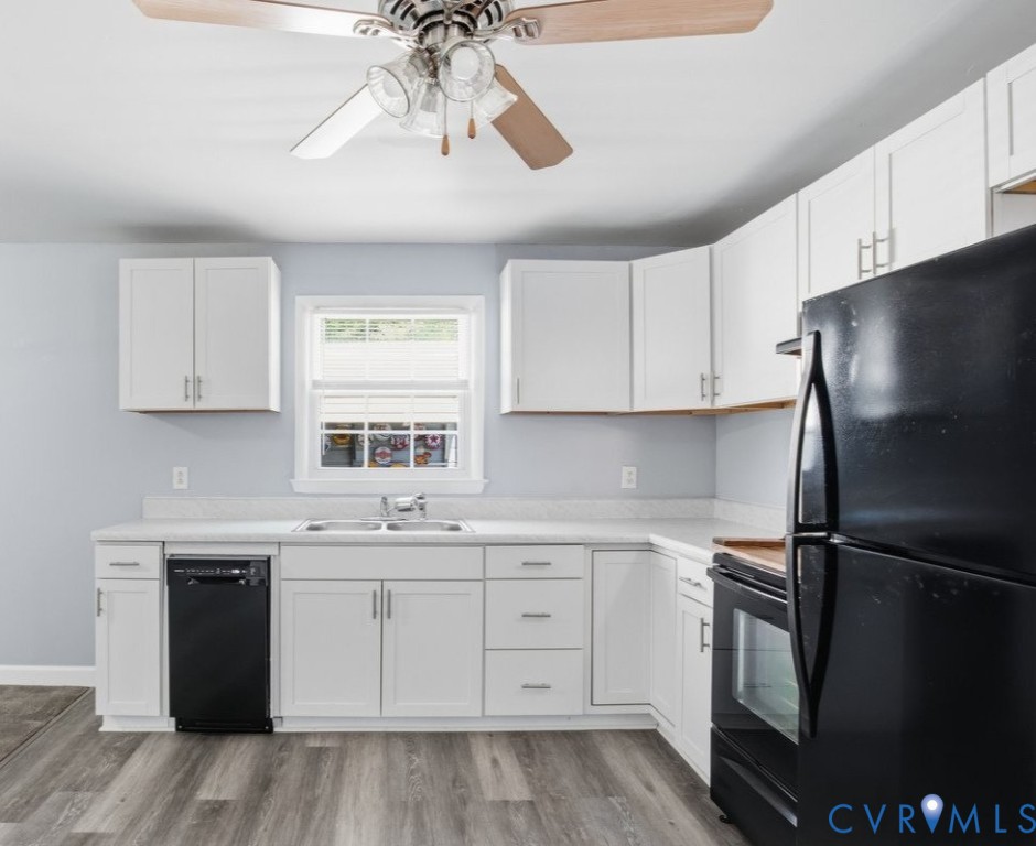 15503 Eppes Road Dewitt, VA 23840 - Photo 10 of 22 a kitchen with a white cabinets and refrigerator