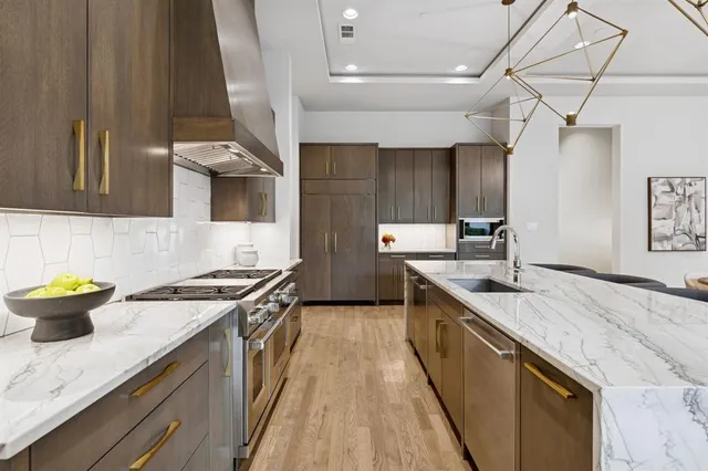 a kitchen with a sink and stove