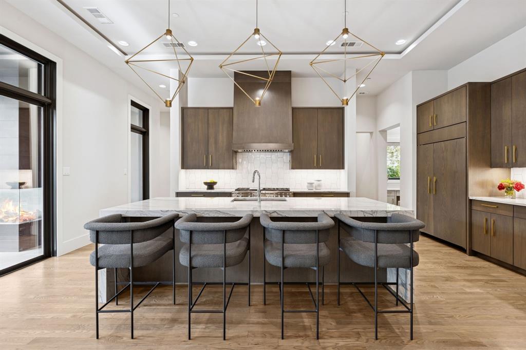 4447 Taos Road Dallas, TX 75209 - Photo 15 of 40 a kitchen with a table and chairs in it